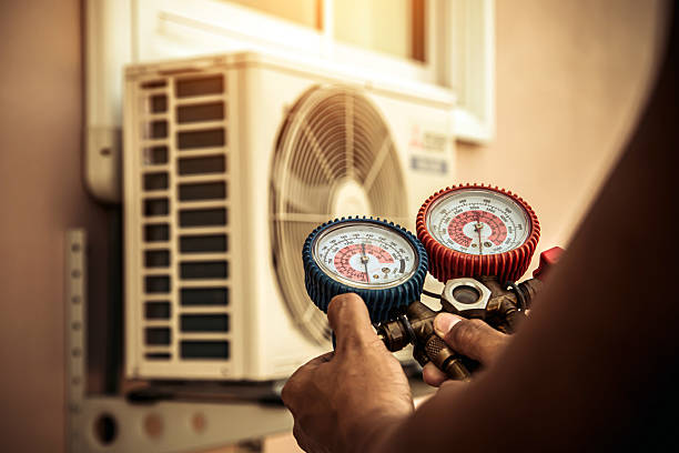 Professional Hvac technician working in Kill Devil Hills, NC